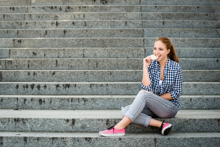 Young woman eating  grapesの写真素材