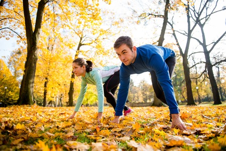 Competing couple prepared for runの写真素材