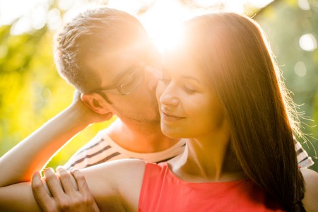 Romance - young couple huggingの写真素材