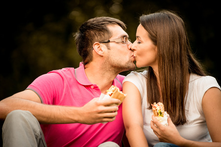 Couple eating outdoorの写真素材