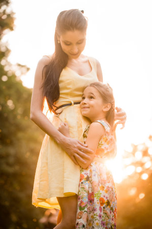 Mother and child at sunsetの写真素材