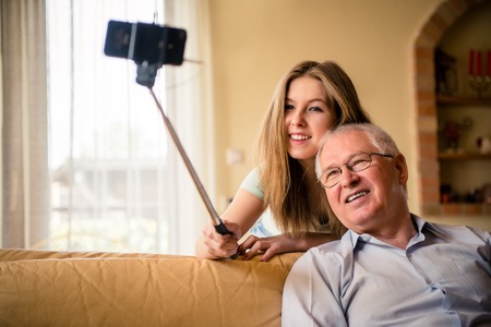 Grandfather with grandchild selfieの写真素材