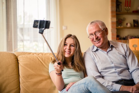 Grandfather with grandchild selfieの写真素材