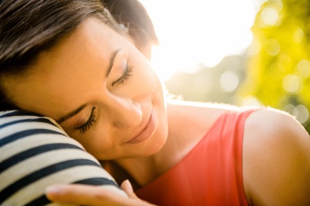 Intimate moments - young couple embracing and hugging in natureの写真素材