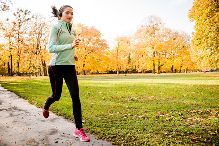 Woman jogging and listening musicの写真素材