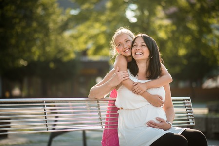 Joyous mother and daughter outdoors. Family bonding concept.の写真素材