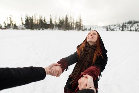 Man holding womans hand. Point of view shot.の写真素材