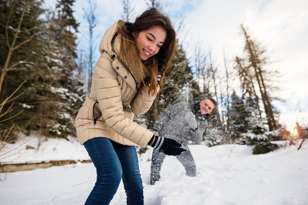 Young woman defending herself from the snowの写真素材