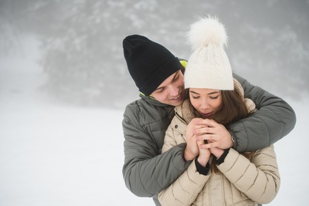 Couple going cold sheltered in winter outdoors
