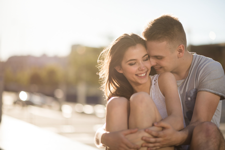 Teen love couple hugging outsideの写真素材