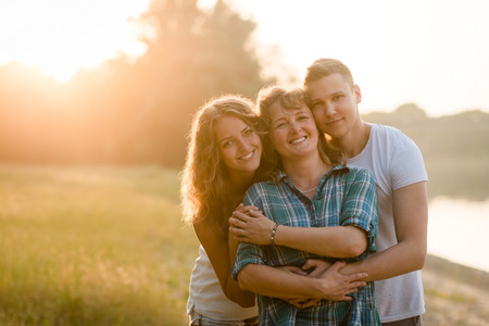Mother, daughter and son posing together. Family bonding.