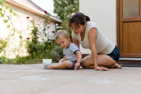 Mother playing with her child outsideの写真素材