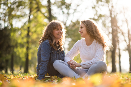 Mother and teenage daughter outdoor portraitの写真素材