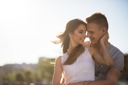 Romantic man holding his girlfriend lovinglyの写真素材