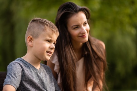 Candid shot of mother and son outdoorsの写真素材