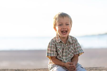 Funny little boy expressing joyの写真素材