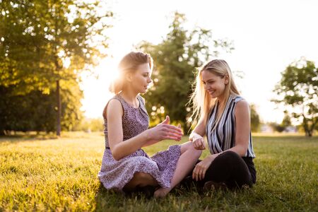 Women in park having a healthy discussionの写真素材