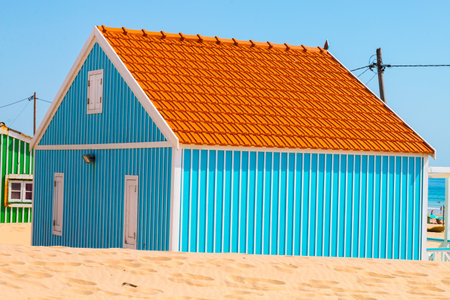 Costa de Caparica is the famous tourist destination, with the typical tiny colorful house, big sandy beaches and the ocean waves in the south of Portugal, near Lisbon.のeditorial素材