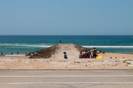 Costa de Caparica is the famous tourist destination, the place is famous for the big waves for surfing and huge sandy beaches. The place is in Portugalのeditorial素材