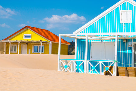 Costa de Caparica is the famous tourist destination, with the typical tiny colorful house, big sandy beaches and the ocean waves in the south of Portugal, near Lisbon.のeditorial素材