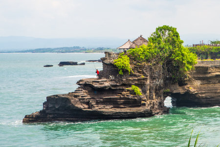 Tanah Lot water temple in Bali. Indonesia nature landscape. Tanah Lot temple in daylight, Bali island. Popular temple of Bali, Indonesia landmark. Famous Bali water temple.のeditorial素材