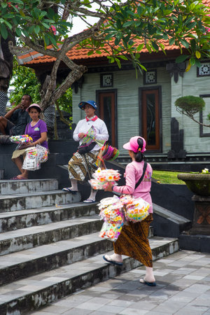 several market place and workers around at Tanah Lot water temple in Bali, a popular temple. Tanah Lot temple in daylight, Bali island.のeditorial素材