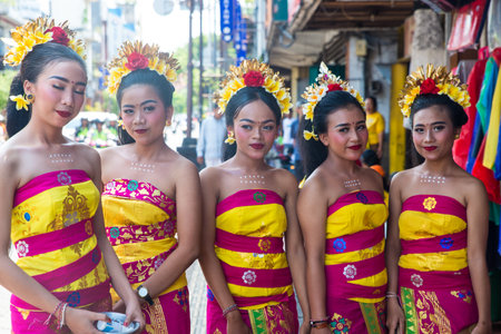 beautiful dancers before to start their show in a traditional holiday in Bali, Indonesia. Beautiful young girls in traditional balinese dress.のeditorial素材