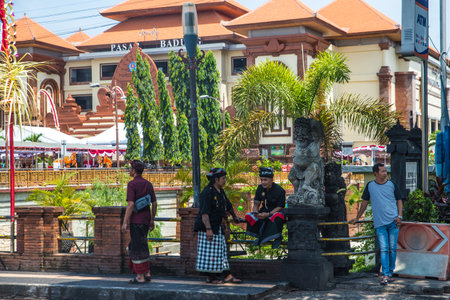 City center of Bali during the morning day. In the main street the life is around the river, is full of people and colorsのeditorial素材