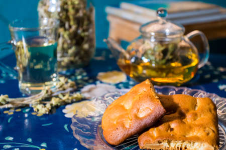Cup of fresh flower and herb arabic tea and some Tasty and healthy almond cookies, rich in vitamins...