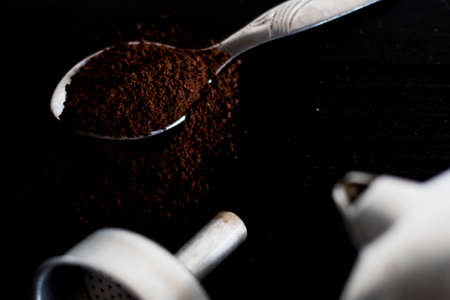 Ingredients for making moka coffee. Moka pot with coffee on dark background. Coffee making concept.の写真素材