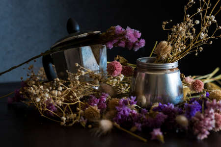 Coffee making concept. Ingredients for making moka coffee. Moka pot with coffee on dark background...