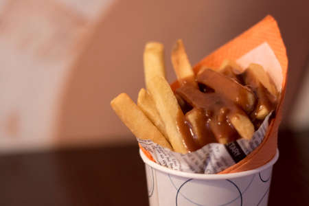 Close-up of tomato Spicy sauce and Fresh French fries, deep fried Homemade Baked potato chips with...