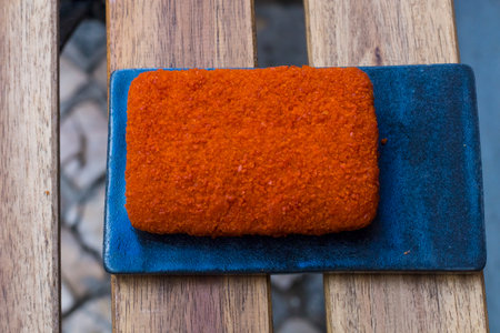 Different type pf simple american fried food on an wooden background. Chicken dishes. meatballs,chicken breast, mozzarella, wings. Different food. A variety of meat dishes in a minimal composition.の写真素材