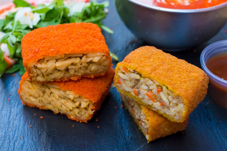 Classic, Italian arancini. deep fried Rice balls with minced meat and some vegetables inside. Tasty...