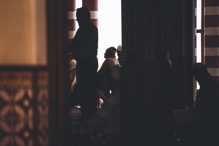 COLOMBO, SRI LANKA - 03-04-2019 : The decorative red-and-white facade of Jamiul Alfar Mosque, Red Mosque, in the oldest districts in Colombo, people stay around praying and spending their daily life.のeditorial素材