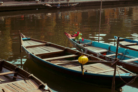 Hoi An, Vietnam - 09-04-2018: Colorful view of busy street and crowded river in Hoi An, Vietnam,...