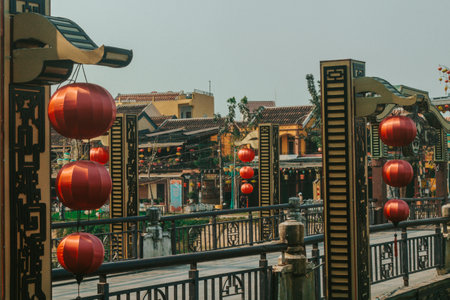 Hoi An, Vietnam - 09-04-2018: Colorful view of busy street and crowded river in Hoi An, Vietnam,...