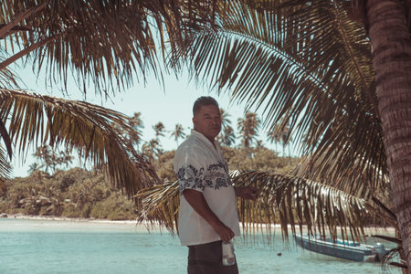 Rarotonga, Cook Island, 09 May 2019 : People enjoy their life vacation on the paradise island of Rarotonga, the Cook Island 's most famous place with his blue sea and white sand.のeditorial素材