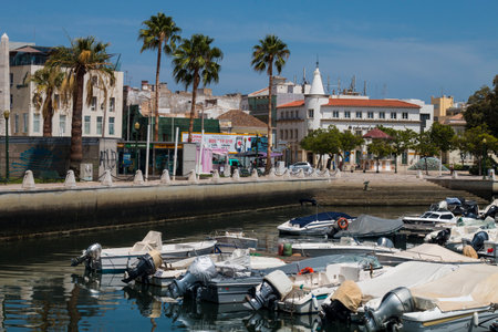 FARO, PORTUGAL - SEPTEMBER 8, 2020: colorful boats in the old harbor of Faro Marina, Portugal.