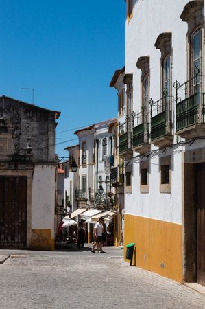 Evora, Portugal: 09/05/2021: Street view with beautiful old residential buildings in Evora city in...