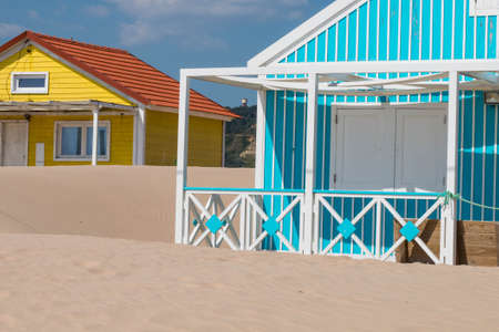 characteristic wooden house along the beach side at Costa da Caparica in Lisbon, Portugal.の写真素材