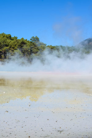 Geothermal Landscape with hot boiling mud and sulfur springs due to volcanic activity in Wai-O-Tapu,...