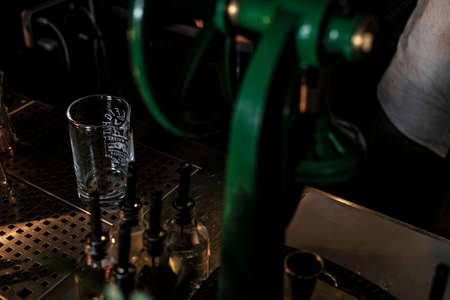 View of a mixer jar on a cocktail bar counter, view of a beautiful cocktail bar in a nightclub.の写真素材