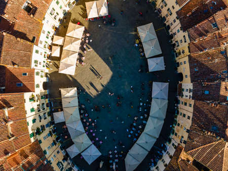 Aerial view of Piazza dell'Anfiteatro, a medieval square with cafÃ¨ and market in Lucca old town,...