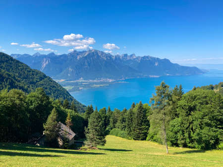 Panorama of the Switzerland Alpine mountains. Ridges, peaks and lake are visible in the background. Beautiful view in the French Canton.の写真素材