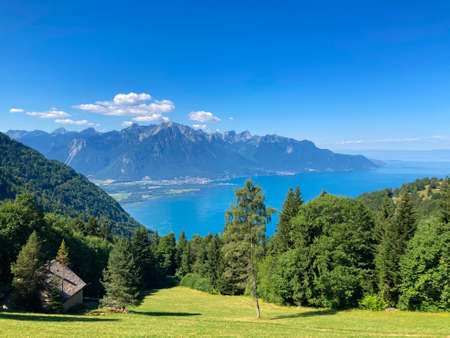 Panorama of the Switzerland Alpine mountains. Ridges, peaks and lake are visible in the background. Beautiful view in the French Canton.の写真素材