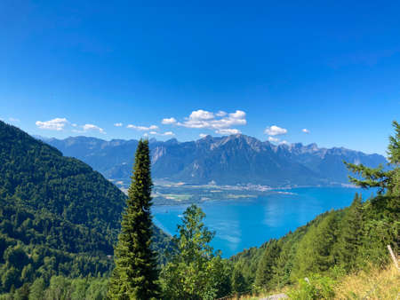 Panorama of the Switzerland Alpine mountains. Ridges, peaks and lake are visible in the background. Beautiful view in the French Canton.の写真素材