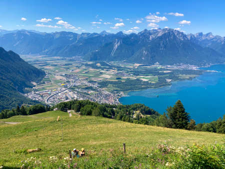 Panorama of the Switzerland Alpine mountains. Ridges, peaks and lake are visible in the background. Beautiful view in the French Canton.の写真素材