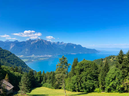 Panorama of the Switzerland Alpine mountains. Ridges, peaks and lake are visible in the background. Beautiful view in the French Canton.の写真素材
