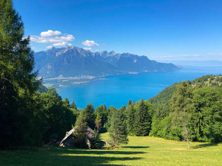Panorama of the Switzerland Alpine mountains. Ridges, peaks and lake are visible in the background. Beautiful view in the French Canton.の写真素材